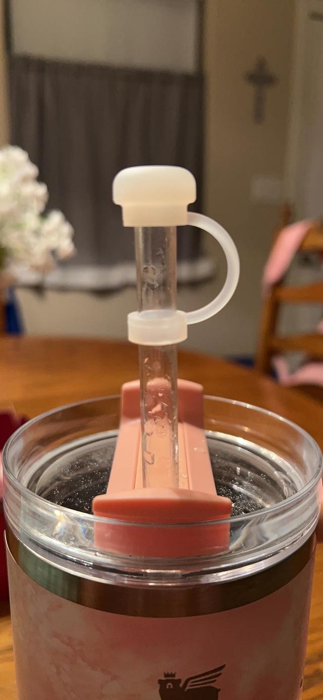 Straw creating a vacuum seal