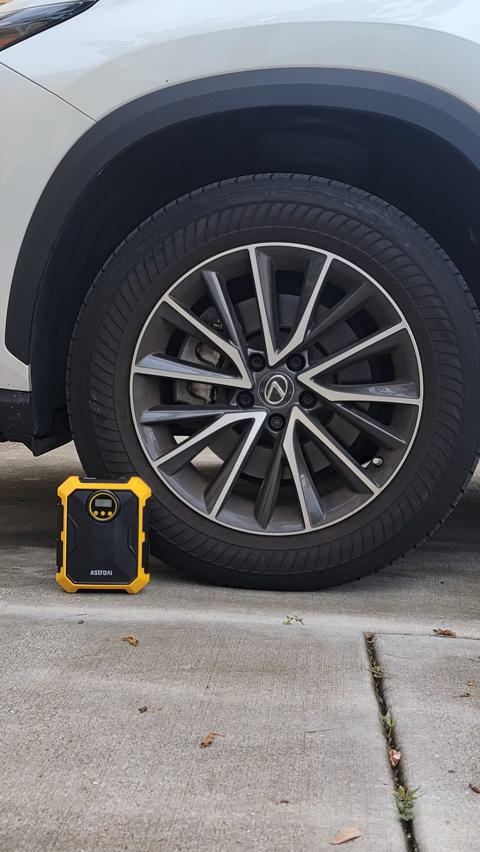 AstroAI Tire Inflator in use