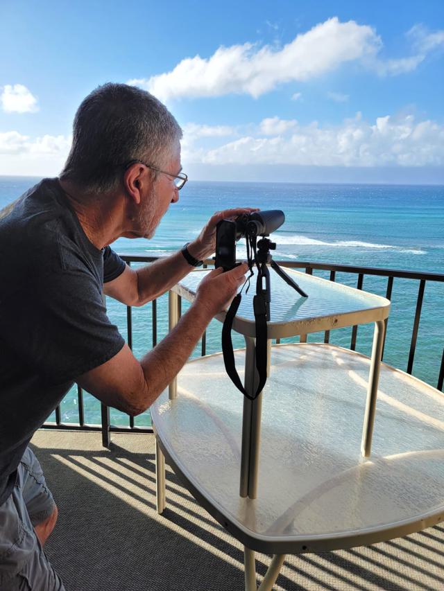 Binoculars in use on a balcony