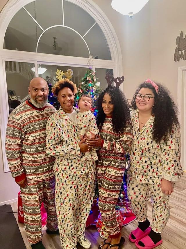 Family members wearing matching pajamas