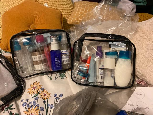 PACKISM TSA Approved Toiletry Bag filled with travel-sized bottles