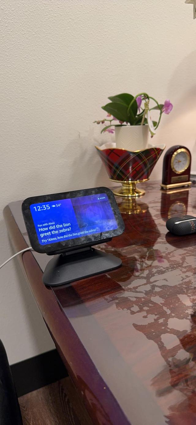 Echo Show 5 displaying music interface