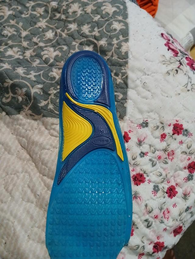 Nike running wearing Dr. Scholl's insoles