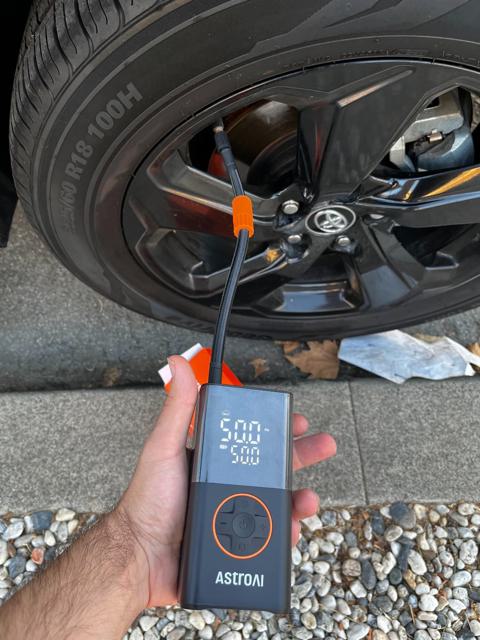 AstroAI Tire Inflator in use