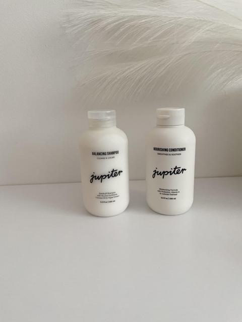 User showing off their healthy, shiny hair with Jupiter products